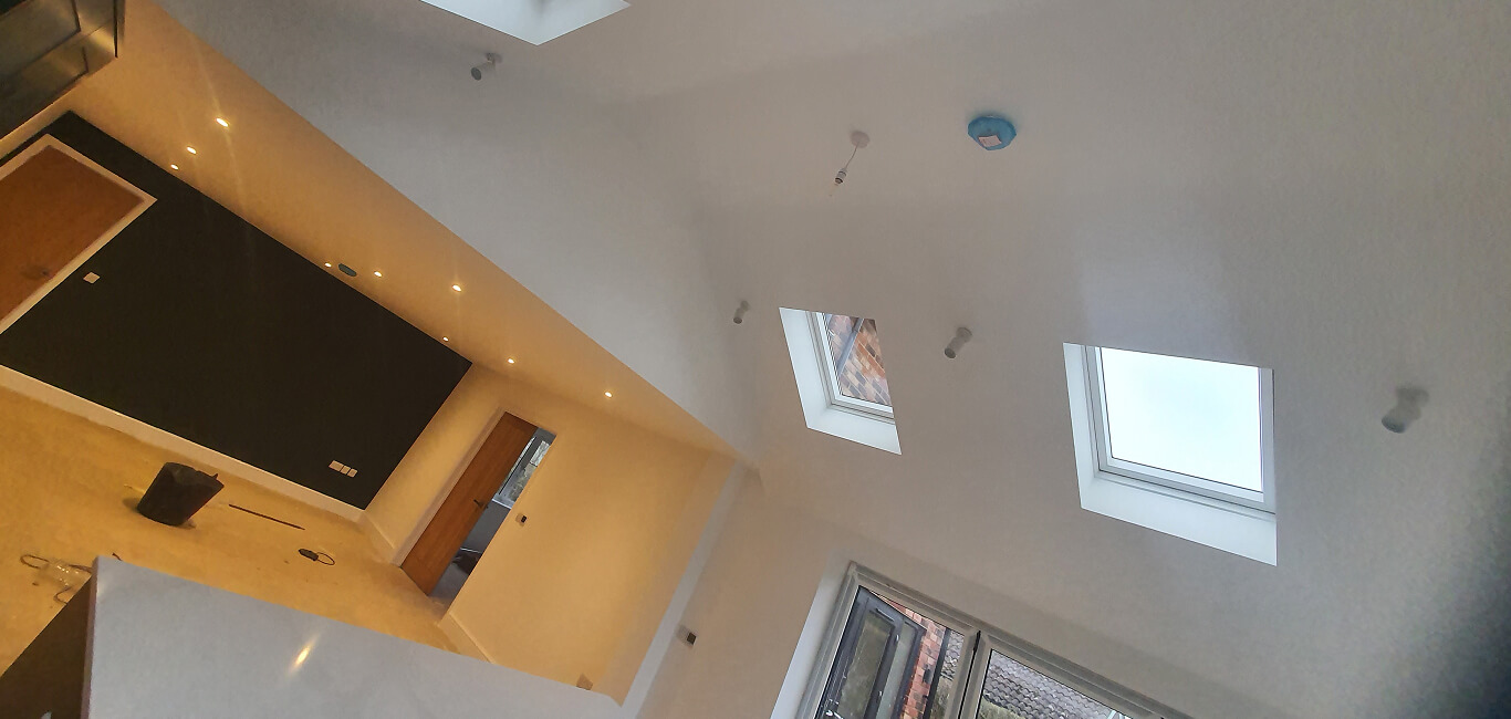 Loft conversion painting — Dulux Trade Supermatt on new plaster, before and after, Stony Stratford