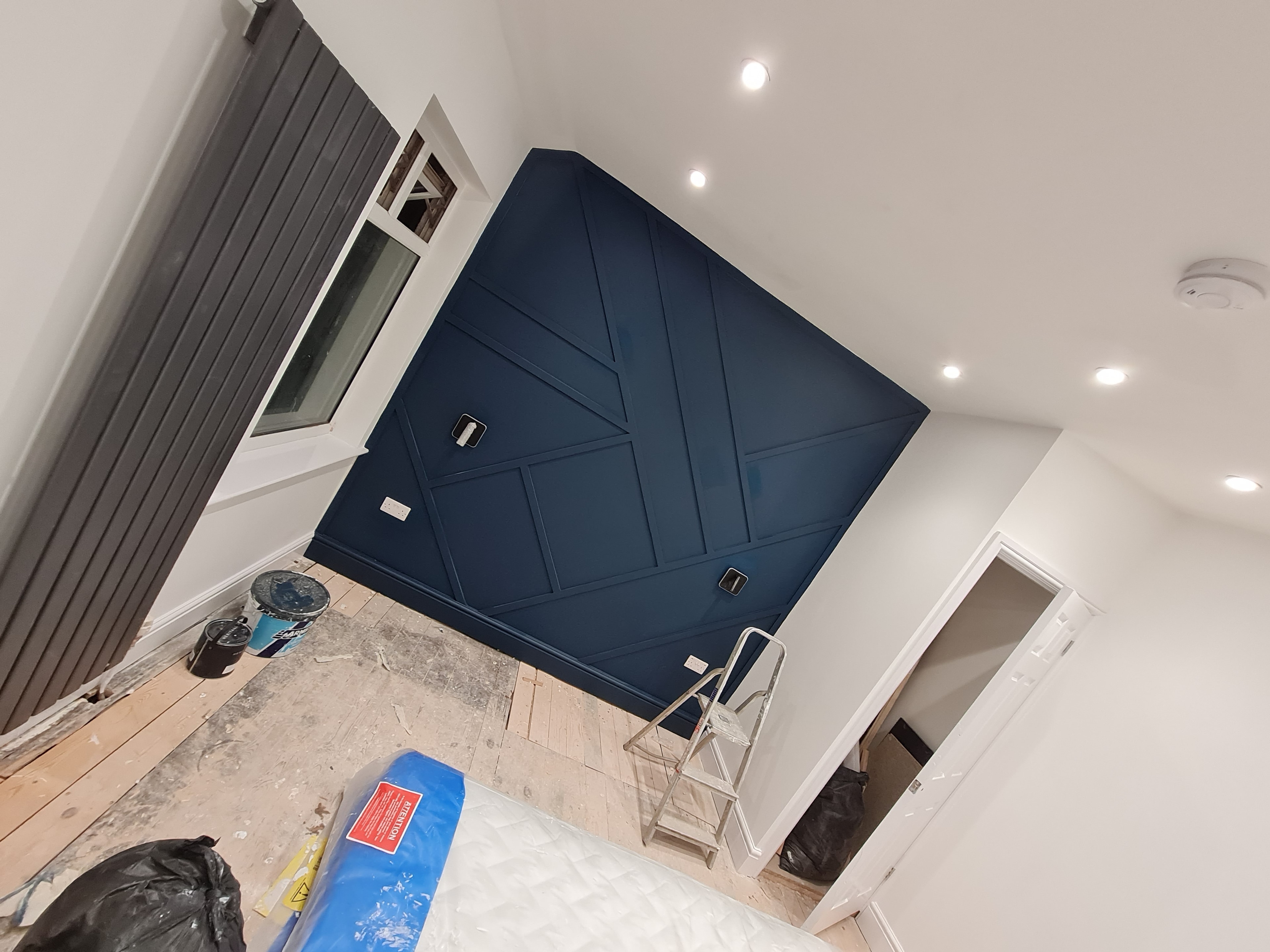 Lounge panelled feature wall painted in Dulux Heritage Ravens Flight — before and after, Milton Keynes