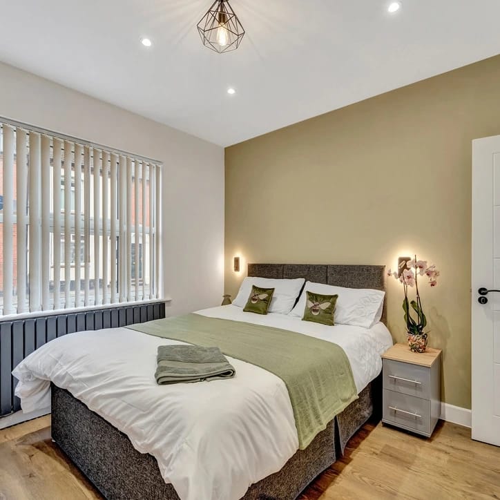 Commercial bedroom painting — warm feature wall