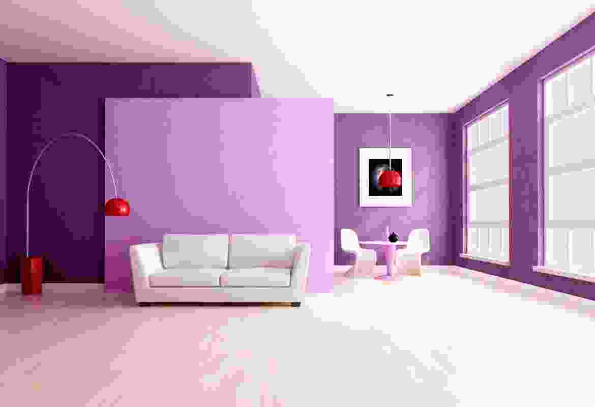 A living room with purple walls and white furniture.