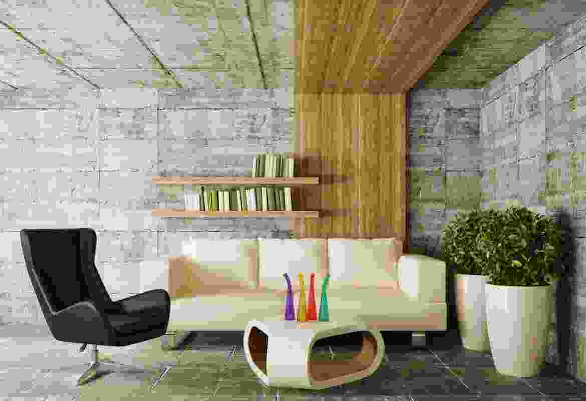 A living room with a white couch and green plants.