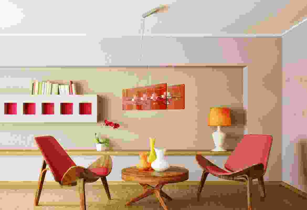 A living room with two chairs and a table.