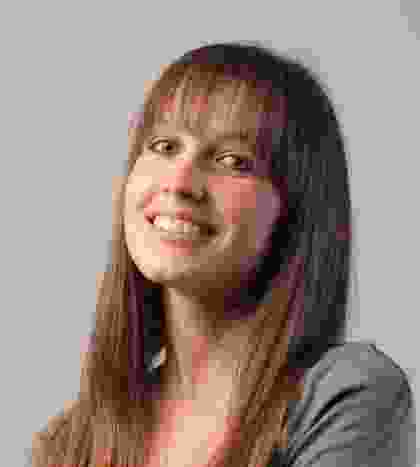 A young woman smiling for the camera.