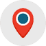 A location pin icon in a white circle.