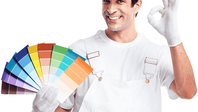 A man with a white helmet holding paint paper palettes