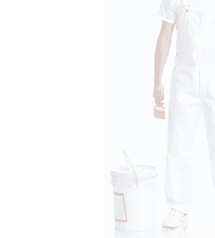 A man in overalls standing next to a bucket of paint.