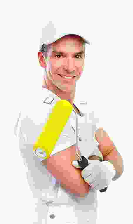 A man holding a yellow paint roller.