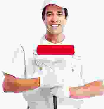 A man holding a paint brush in front of a white background.
