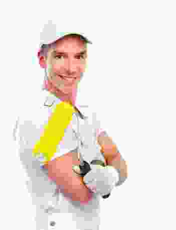 A man holding a yellow paint brush.