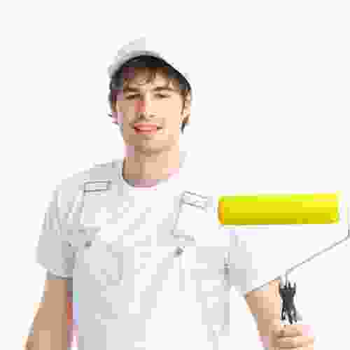 A man holding a paint roller in front of a white background.