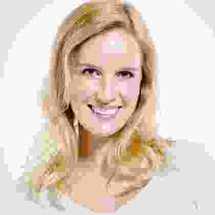 A pixelated image of a woman smiling.