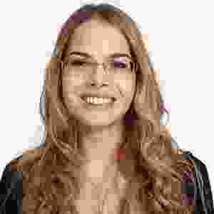 A pixelated image of a woman with glasses.