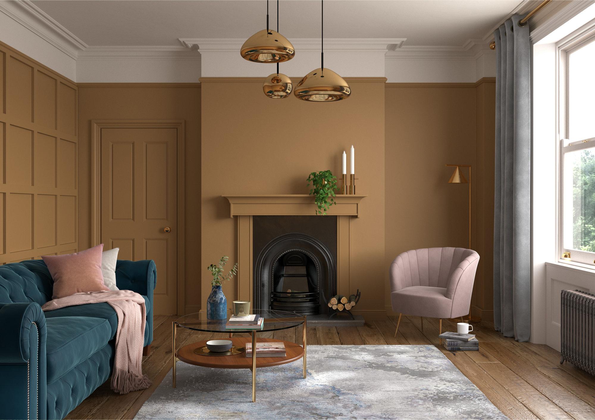 A living room with tan walls and a blue couch.