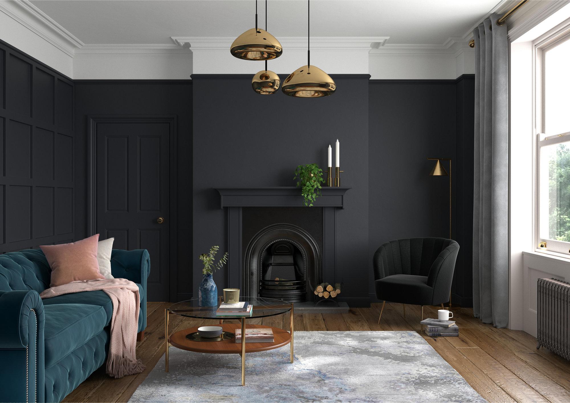 A living room with black walls and a blue couch.