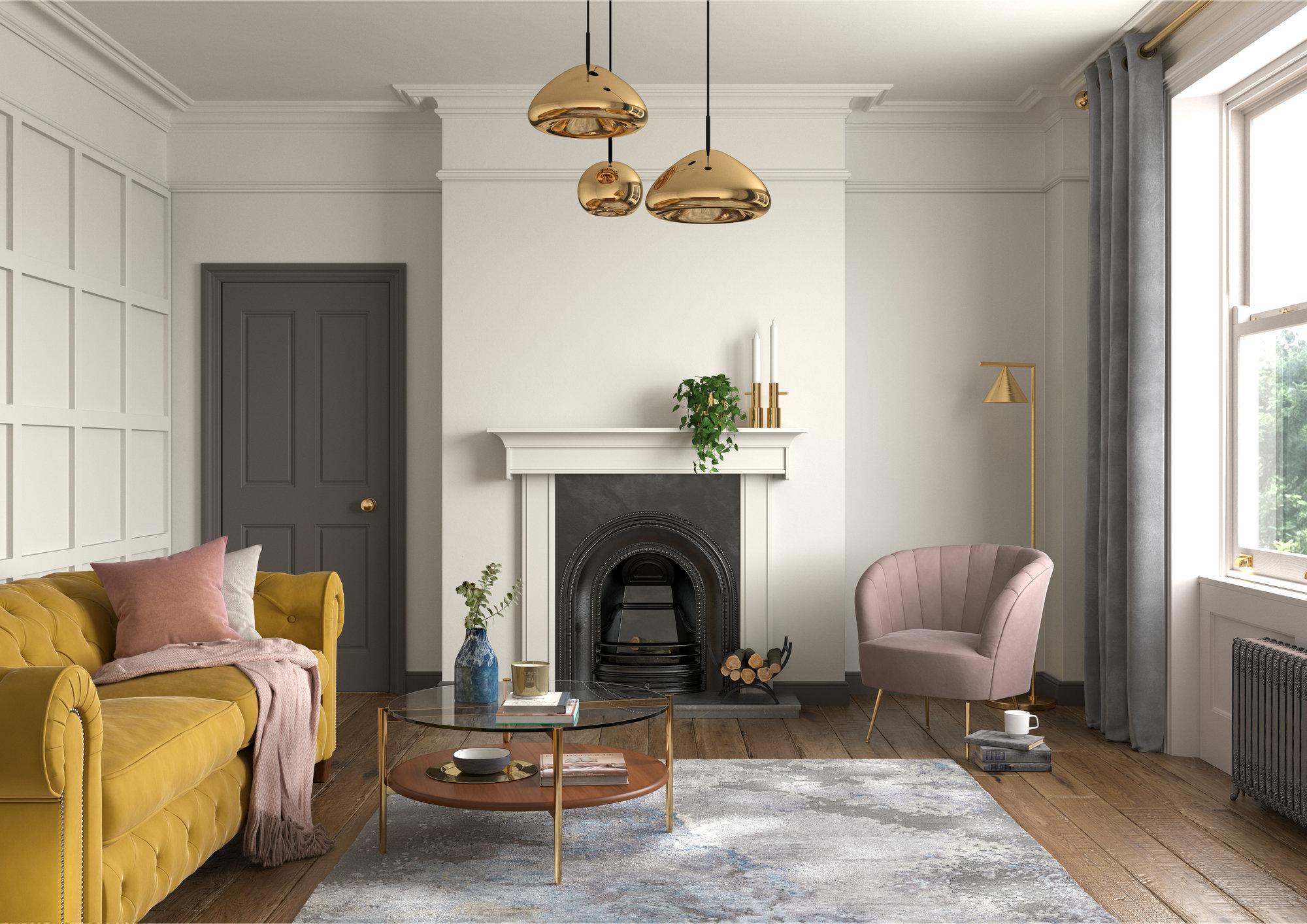 A living room with a yellow couch and a fireplace.