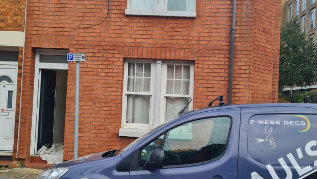 Our service car in front of a house