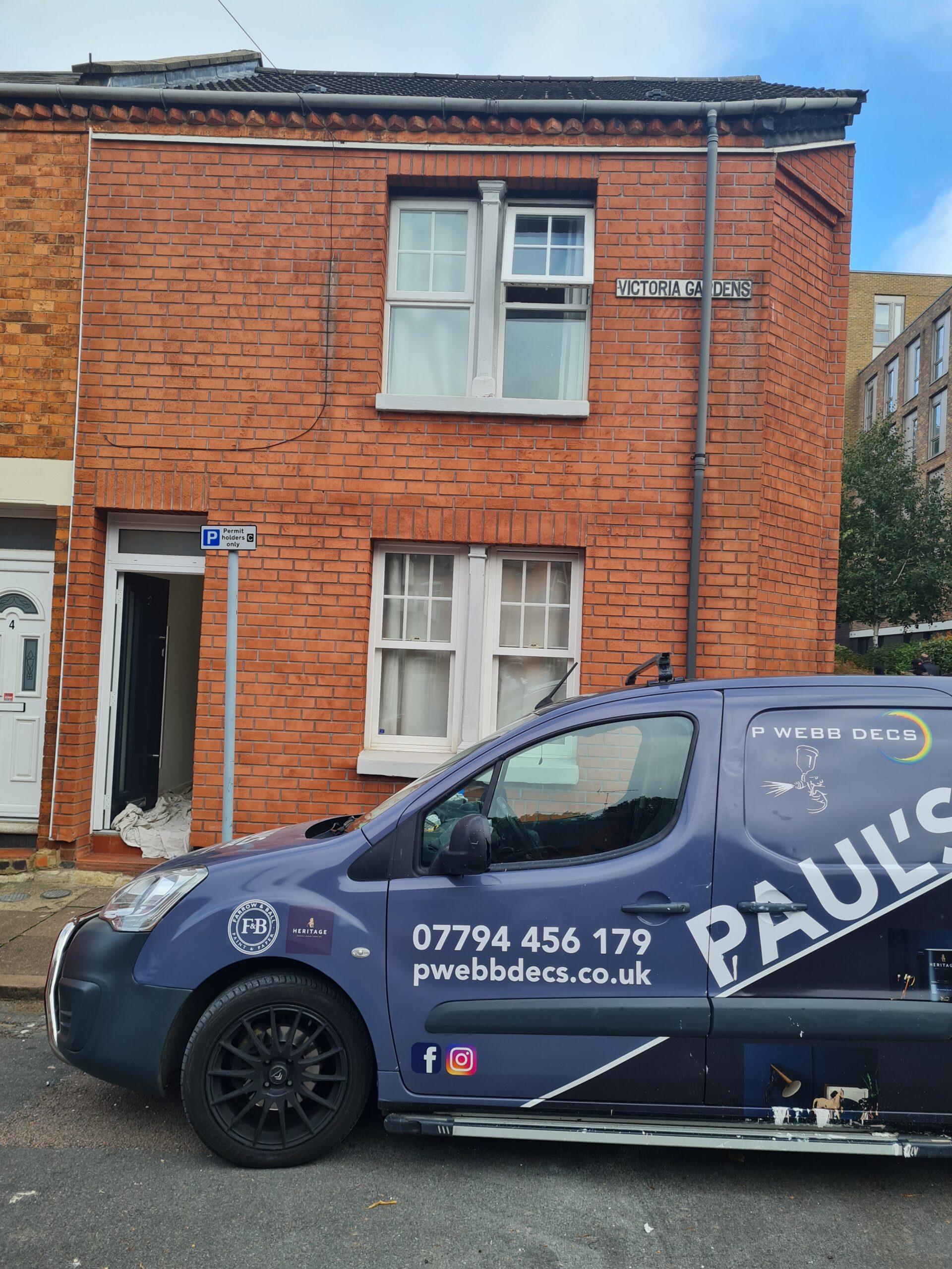 Our service car in front of a house