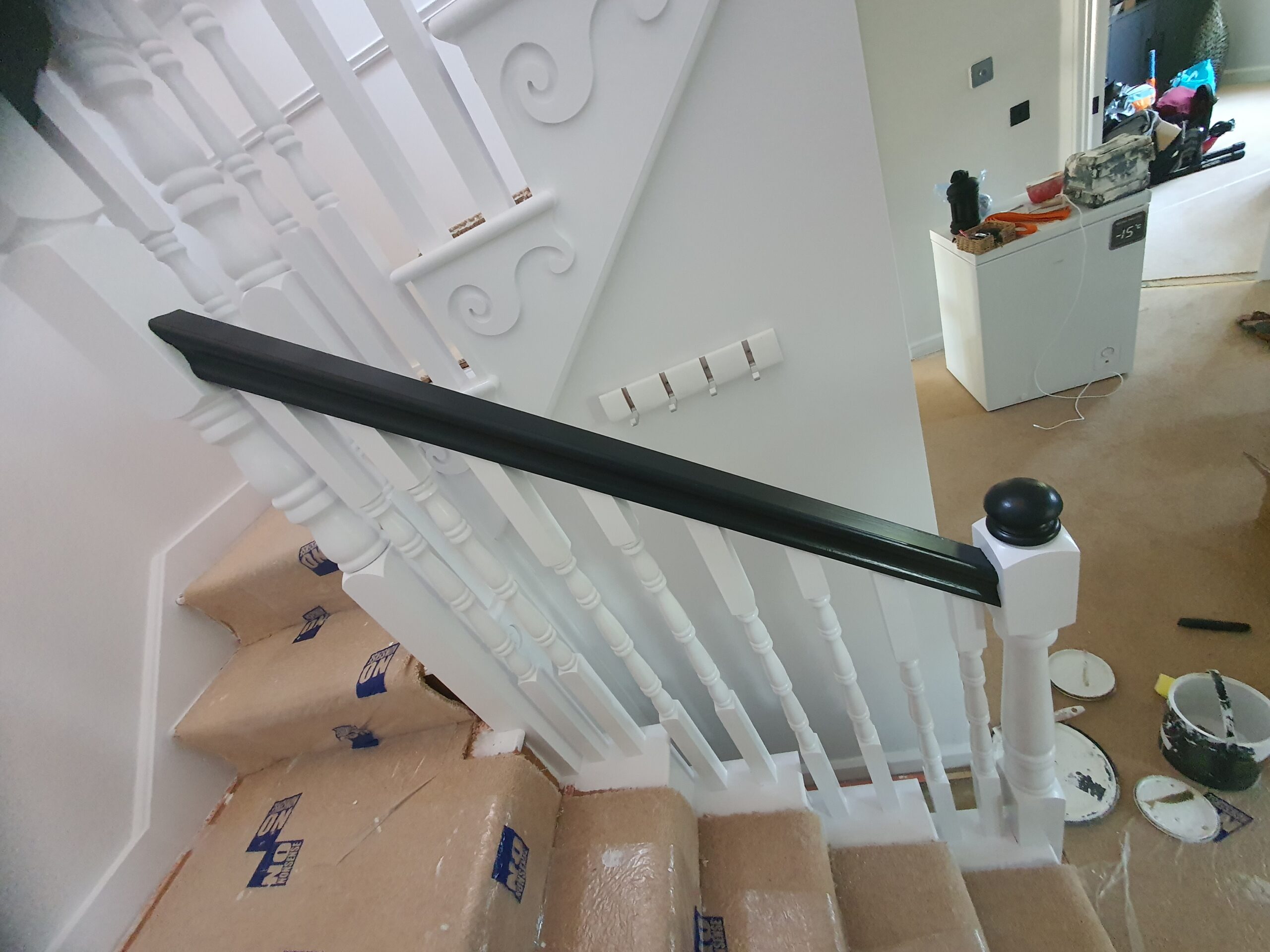 A view of the bottom part of stairs from above.