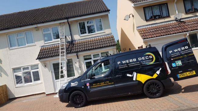 A van is parked in front of a house.