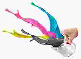 A person is pouring paint into a can.