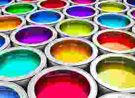 A group of colorful paint cans on a white background.
