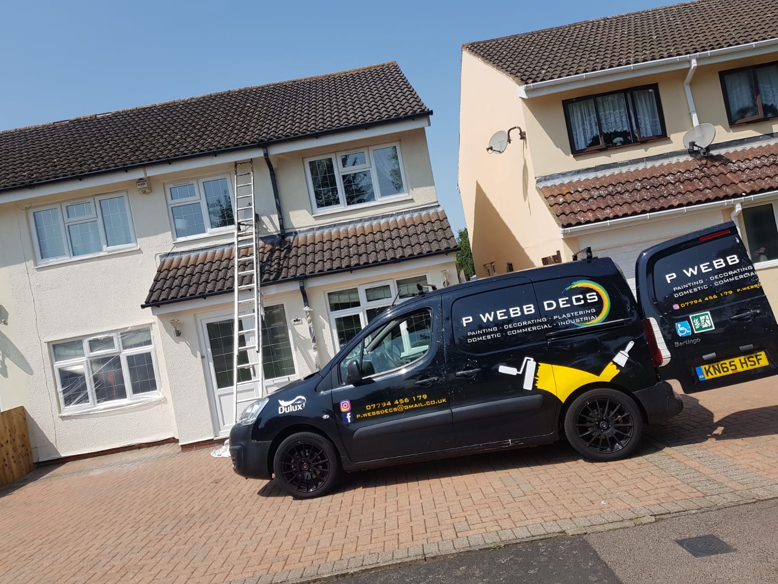 A van is parked in front of a house.