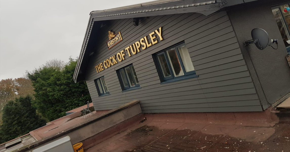 A building with a sign that says the castle of whisky.
